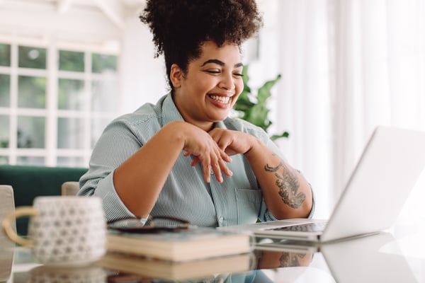 woman sitting in front of laptop computer